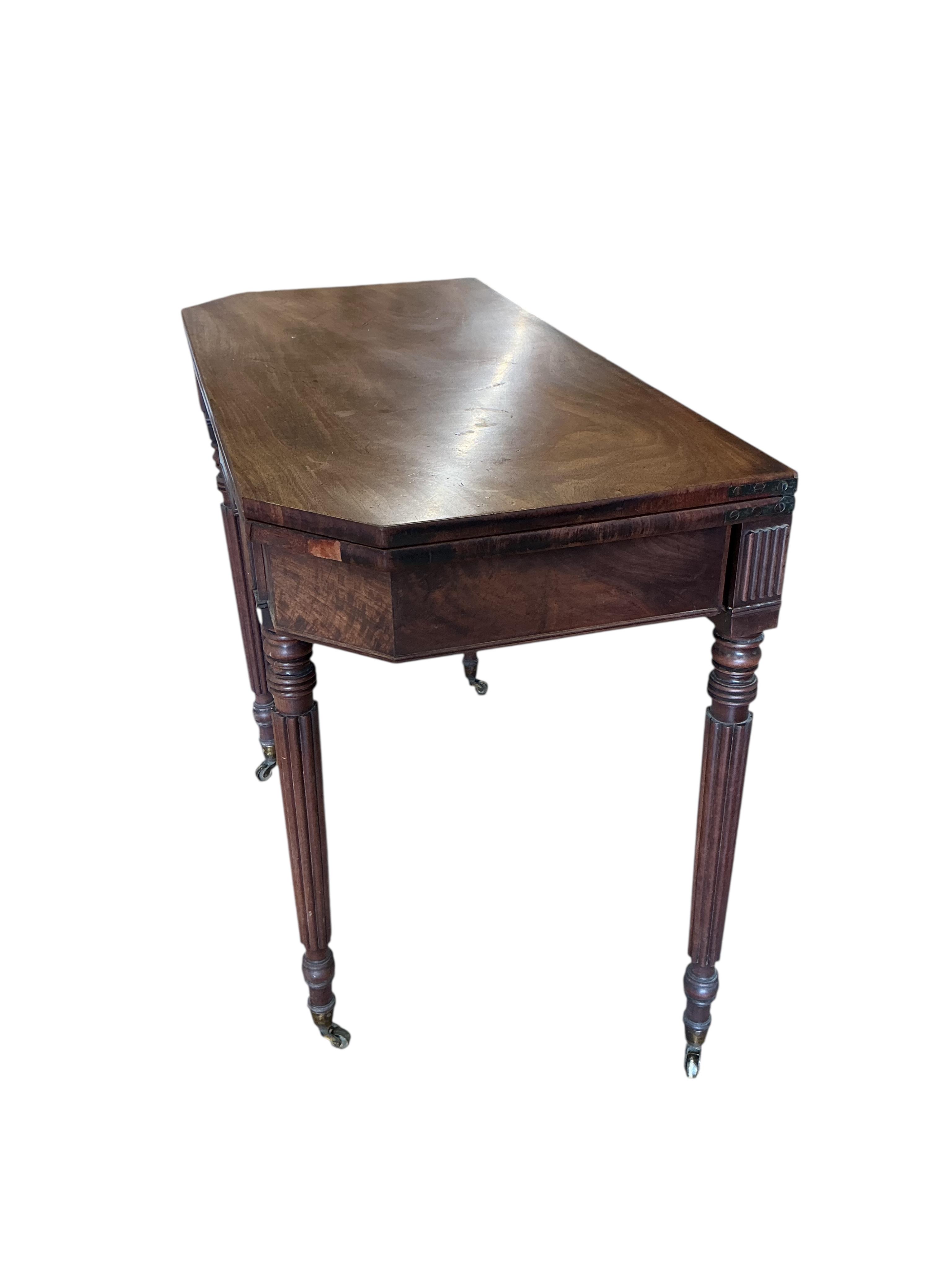 A Regency mahogany folding tea table, width 91cm, depth 45cm, height 74cm